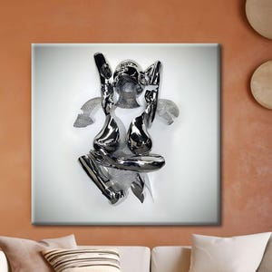 May include: A metallic sculpture of a figure with outstretched arms and a stylized body. The sculpture is mounted on a white square and set against an orange wall. The sculpture has a reflective, chrome-like finish.