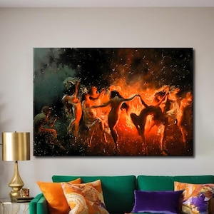 May include: An oil painting depicts figures dancing in a fiery, orange-lit scene. The artwork, mounted on a wall, is above a green sofa with orange and purple throw pillows. An orange chair and gold lamp are also visible.