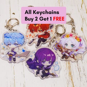 Könnte beinhalten: Eine Sammlung von Acryl-Schlüsselanhängern mit Charakteren im Anime-Stil. Jeder Schlüsselanhänger hat ein einzigartiges Design mit leuchtenden Farben und detaillierten Kunstwerken. Die Schlüsselanhänger sind an silberfarbenen Metallverschlüssen befestigt. Der Text auf dem Bild lautet "All Keychains Buy 2 Get 1 FREE."