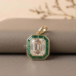 Yellow gold emerald cut lab grown diamond pendant with a distinctive geometric gemstone design.