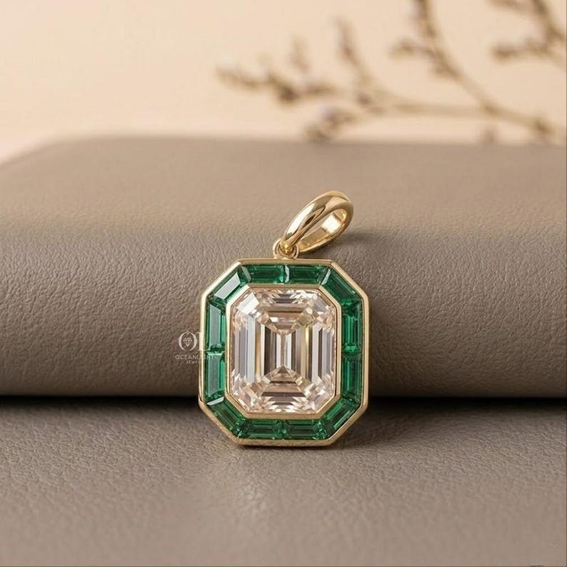 Yellow gold emerald cut lab grown diamond pendant with a distinctive geometric gemstone design.
