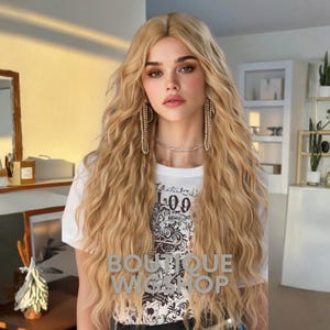 May include: A woman with long, wavy blonde hair. She is wearing a white t-shirt with a graphic print and the text "09". The image also features long, dangling earrings and a silver necklace. The text "BOUTIQUE WIG SHOP" is also visible.