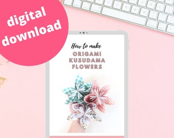 May include: A digital download for making origami kusudama flowers. The image shows a tablet screen with the title "How to make ORIGAMI KUSUDAMA FLOWERS" and a hand holding a bouquet of three origami flowers. The flowers are made from patterned paper in pink, green, and white.