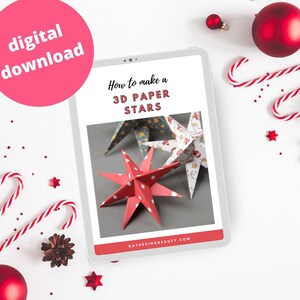 May include: A digital download for a craft project to make 3D paper stars. The image shows a tablet screen with the title "How to make a 3D Paper Stars" and a photo of three paper stars.