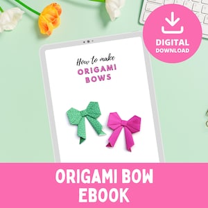May include: A digital download ebook titled "Origami Bow Ebook" displayed on a tablet. The tablet shows instructions on how to make origami bows, with examples of a green polka-dot and a pink bow. A pink circle with "Digital Download" text is visible.