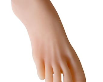 May include: A close-up of a light-skinned foot, with visible toes and a smooth texture. The foot is slightly curved, with the toes pointing downwards. The skin tone is a pale, neutral color.
