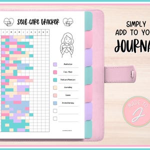 May include: A pink planner with a self-care tracker page. The tracker includes a grid for daily entries and categories like meditation and face masks. Text on the page reads "SELF-CARE TRACKER" and "SIMPLY ADD TO YOUR JOURNAL."