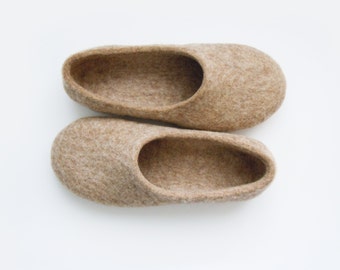 Eco friendly handmade felted slippers in natural light brown color.