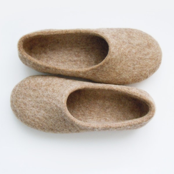 Eco friendly handmade felted slippers in natural light brown color.