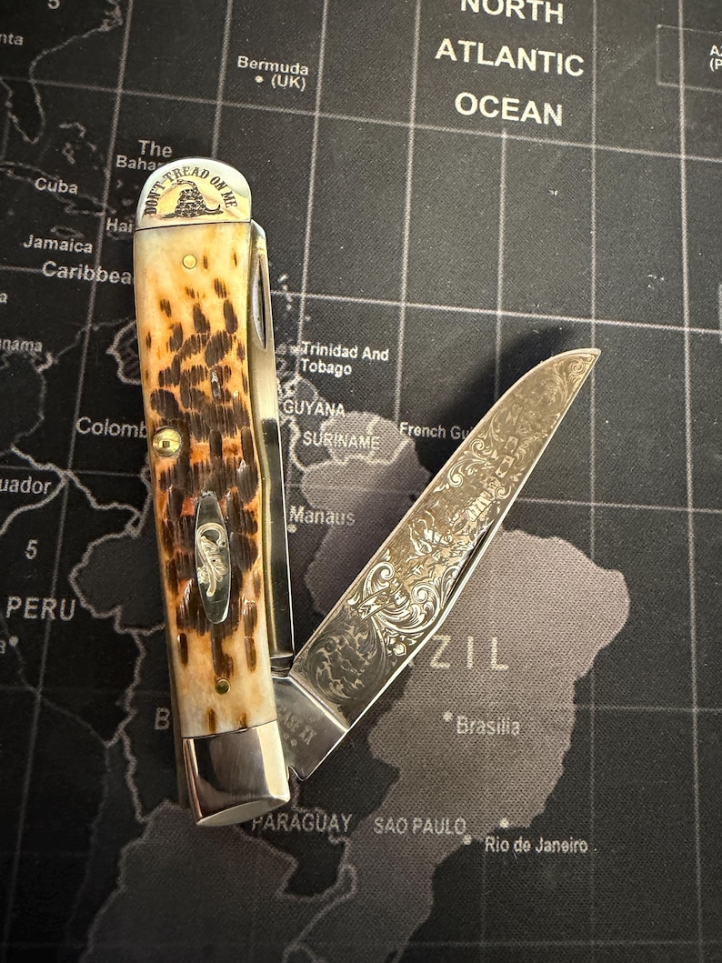 May include: A set of three ceramic mugs with a speckled, matte finish in cream, light grey, and dark grey. Each mug has a simple, minimalist design and a rounded handle.