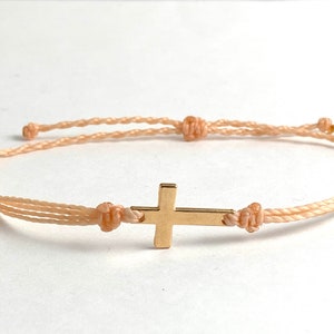blush peach with gold cross
