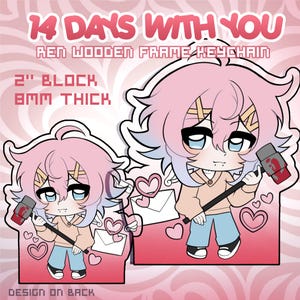 May include: A pink and blue cartoon character keychain with the text "14 DAYS WITH YOU" and "REN WOODEN FRAME KEYCHAIN". The keychain is 5.08 cm in size and 8mm thick. The design is on the back.