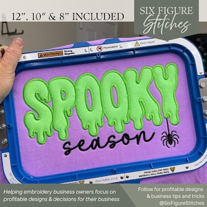 May include: A blue embroidery hoop holding light purple fabric with the lime green embroidered text SPOOKY in a dripping font, the black embroidered text season, and a small black spider graphic. The hoop includes 12, 10, and 8 inch sizes.