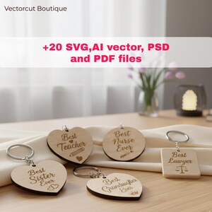 May include: Wooden keychains in various shapes, including hearts and circles, with engraved text. The keychains say "Best Teacher Ever," "Best Nurse Ever," "Best Sister Ever," "Best Granddaughter Ever," and "Best Lawyer Ever."