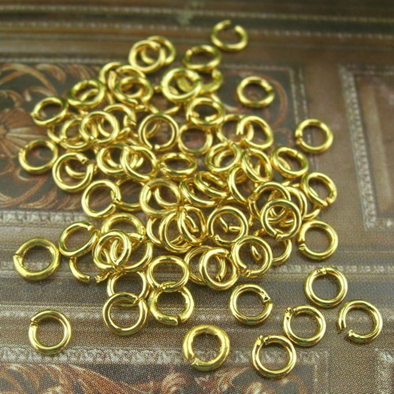 200 pcs 0.7 x 3mm Golden Plated Jumpring. image 2