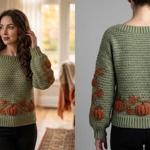 Puede incluir: Un su&eacute;ter de manga larga color verde salvia con un patr&oacute;n de tejido texturizado y calabazas naranjas bordadas con enredaderas y hojas marrones a lo largo del dobladillo y las mangas. La prenda tiene un cuello ancho y pu&ntilde;os acanalados.