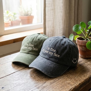 May include: A set of three ceramic mugs with a speckled, matte finish. Each mug features a different color: light blue, cream, and gray. The mugs have a simple, modern design with a rounded shape and a comfortable handle.