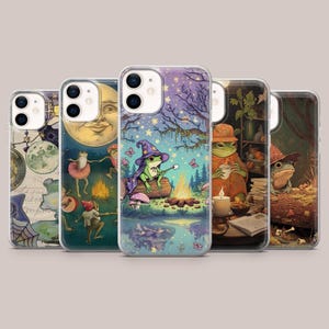 May include: A selection of phone cases featuring fantasy-themed illustrations. Designs include a frog roasting a marshmallow, and other whimsical scenes. The cases have a clear border and a glossy finish.