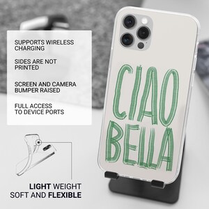 May include: Clear phone case with the words "CIAO BELLA" in green script. The case is on a black stand. The case is light weight, soft, and flexible. It supports wireless charging and has a raised screen and camera bumper.