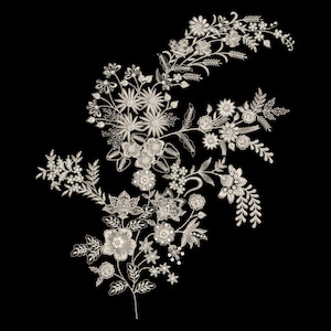 May include: An intricate embroidery design featuring a cluster of off-white floral motifs, including various blossoms, buds, and detailed leaves, arranged in a branching pattern against a solid black background with fine thread textures.