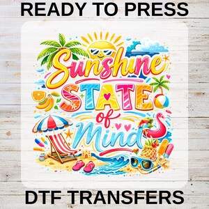 May include: Colorful graphic with the words "Sunshine State of Mind" in a playful font, featuring beach elements like a beach chair, sunglasses, and a flamingo float. The design includes a sun, palm trees, and waves, evoking a tropical theme.