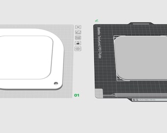 May include: Two 3D models of a square object with rounded corners. One is white, the other is grey, both on a grey surface. The white model has a cutout and holes. The grey model is on a black surface with text.
