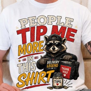 May include: White t-shirt with a raccoon graphic wearing sunglasses and a black hoodie. The shirt features text that reads "PEOPLE TIP ME MORE IN THIS SHIRT." A delivery bag and a jar of tips are also shown.