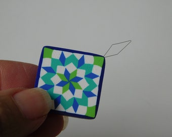 Needle Threader, blue and green Carpenters Wheel quilt block