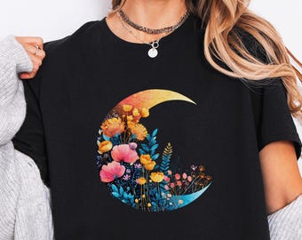 Maglietta con luna crescente floreale, arte botanica notturna colorata, maglietta grafica boho celeste