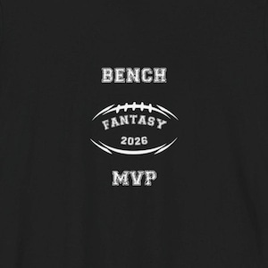 May include: Black t-shirt with white text. The words "BENCH", "FANTASY 2026", and "MVP" are displayed in a stylized font. The word "FANTASY" is inside a football shape.