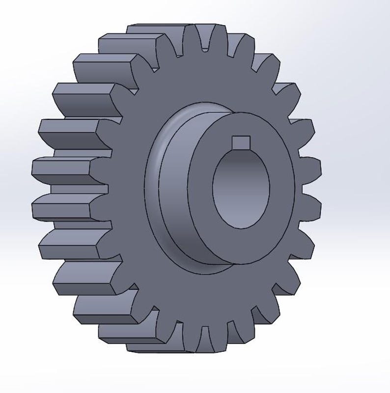 May include: A gray metal gear with evenly spaced teeth and a central hub. The gear's design features a circular center with a square keyway, and the teeth are precisely cut for mechanical function.