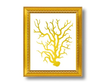 May include: A gold-colored coral silhouette print in a gold frame. The print is on a white background.