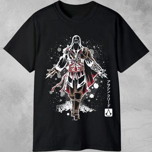 May include: Black t-shirt featuring a stylized illustration of a figure from the Assassin's Creed video game series. The design includes a hooded character with intricate details in red, white, and brown, with Japanese text and the words "DIGITAL DOWNLOAD" at the top.