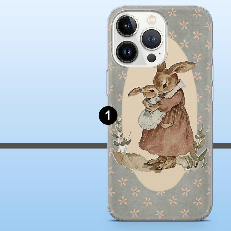 May include: A clear phone case featuring a watercolor illustration of two rabbits. The larger rabbit is holding a smaller one. The background is a light gray with small pink flower patterns. The case has a clear border.