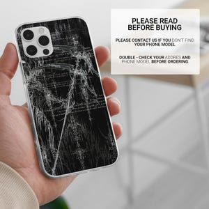May include: A black phone case with a detailed white graphic design featuring a trident and other abstract elements. The case is held in a hand. Text on the image reads "PLEASE READ BEFORE BUYING" and other instructions.