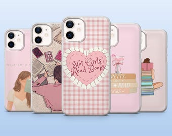 May include: A collection of pink phone cases with various designs. One case features a heart with the text "Hot Girls Read Books." Other cases display illustrations of people reading, books, and a cocktail. The cases have a light blue background.