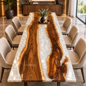 May include: A rectangular dining table featuring two long, natural-edged walnut wood slabs separated by a translucent, pearlescent white resin river. The table is supported by a dark metal base and surrounded by six upholstered beige chairs.
