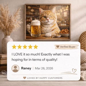 a framed painting of a cat wearing glasses and holding a beer mug, with a rating of 4 stars and a review from Randy dated March 26, 2026.