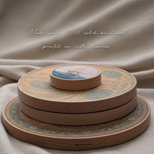 a wooden object with a circular design on it, placed on a beige cloth background.