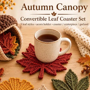 May include: A crochet Autumn Canopy Convertible Leaf Coaster Set featuring a brown and beige acorn-shaped holder containing five distinct leaf-shaped coasters in red, orange, yellow, beige, and green, with a ceramic mug resting on one coaster.