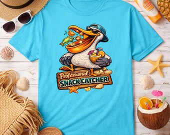 Camiseta divertida de pelícano "Cazador de bocadillos profesional" / Camiseta con estampado playero / Camiseta de vacaciones de verano / Camiseta divertida costera
