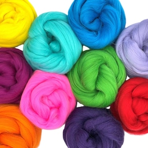 May include: A selection of vibrant wool roving in shades of yellow, turquoise, blue, lilac, green, pink, orange, and red. The wool is arranged in soft, circular bundles, ideal for craft projects.