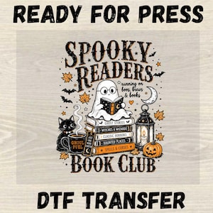 May include: A DTF transfer featuring the text READY FOR PRESS at the top and DTF TRANSFER at the bottom. The central graphic shows a ghost reading a book atop a stack of books labeled GHOST STORIES, WITCHES & WIZARDS, CLASSIC HORRORS, HAUNTED PLACES, and SPELLS & CURSES, with a black cat, a lantern, a pumpkin, and the text SPOOKY READERS BOOK CLUB.