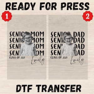 May include: Two DTF transfer sheets labeled READY FOR PRESS. Each features a black and white photo of a child wearing glasses, surrounded by repeating text SENIOR MOM or SENIOR DAD, CLASS OF 2027, and the name Emily in a black script font.