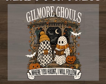 May include: A DTF transfer design featuring two ghosts in a gazebo with autumn leaves, pumpkins, and bats. The text reads "GILMORE GHOULS" and "WHERE YOU HAUNT, I WILL FOLLOW". One ghost wears a beanie and holds a mug, while the other reads a book.
