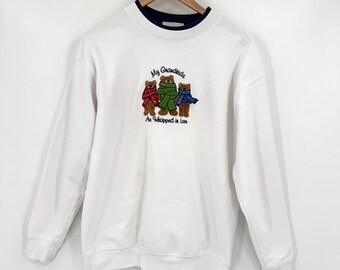 Sudadera blanca talla L con estampado de oso "Mis nietos están envueltos en amor" de M&C Sportswear.