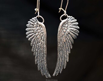 Silver earrings feather wings angel