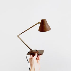 May include: A set of three ceramic mugs with a speckled, matte finish. The mugs are in shades of cream, light gray, and dark gray. Each mug has a simple, minimalist design, perfect for coffee or tea.