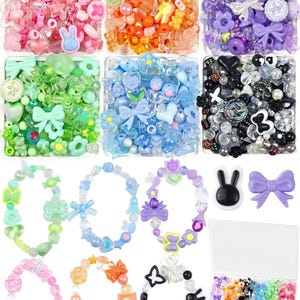 May include: A collection of colorful plastic beads in various shapes including flowers, bows, hearts, and animals, organized by color in six square containers. Includes six finished beaded bracelets and a rectangular storage box with mixed beads.