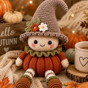 May include: A crochet doll featuring a beige head with pink cheeks, a brown pointed hat adorned with small crocheted flowers and leaves, a green ruffled collar, and a round orange pumpkin-shaped body with striped legs and brown feet.